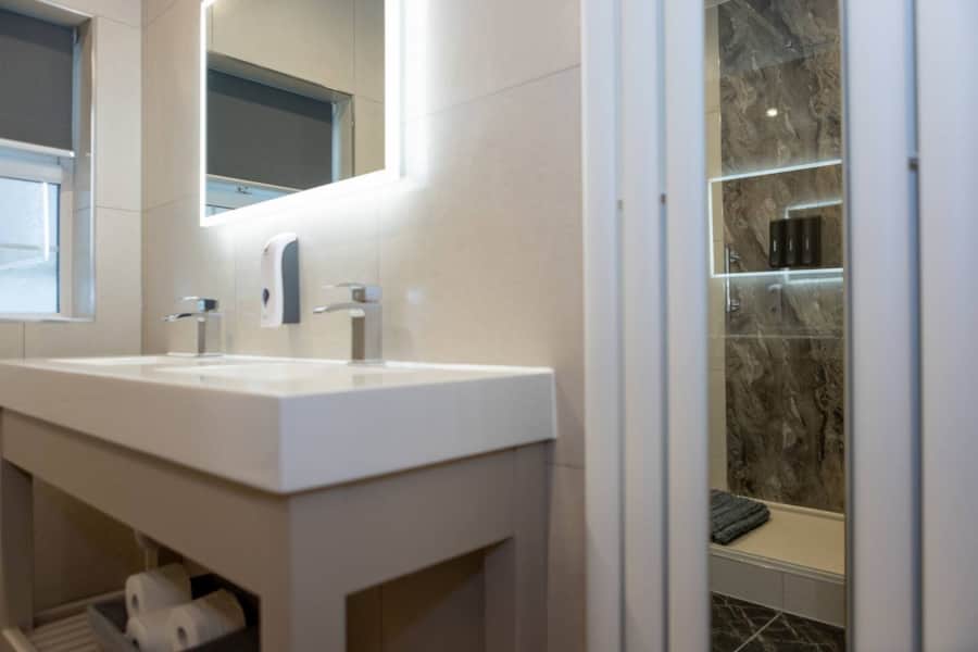 Bathroom washbasin and shower in Apartment 1
