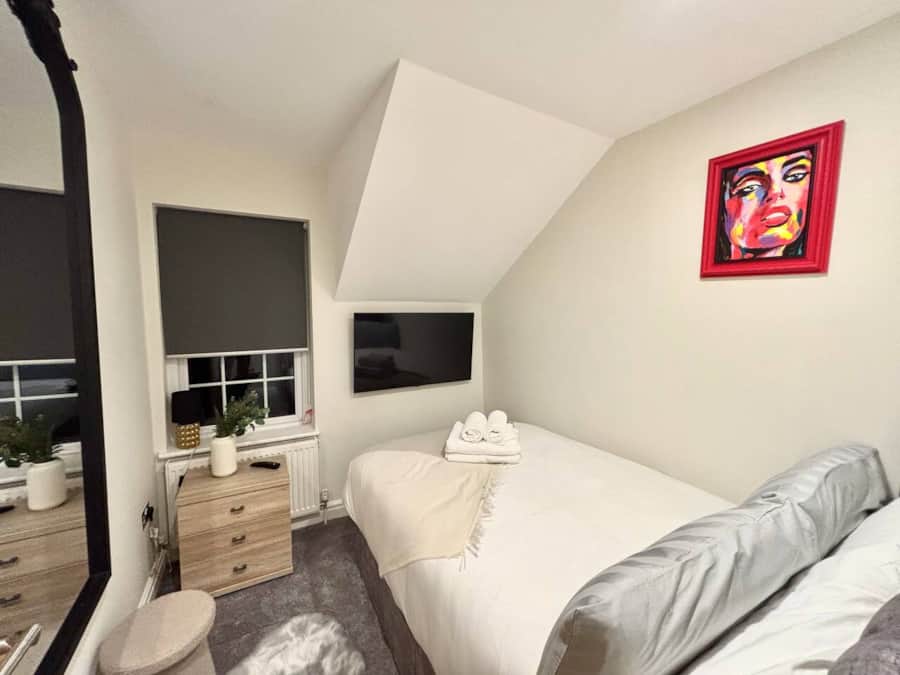 Second bedroom with television in Apartment 3